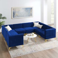 a living room with blue couches and white coffee table