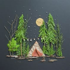 a tent in the middle of some trees with a moon above it and stars around it