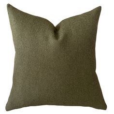 a green pillow on a white background