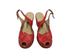 Vintage 1940s Red Leather Wedge Sandals, Women's WWII Era Shoes, Approx. Size 36 EU. Step into a piece of history with these charming 1940s French vintage wedge sandals. Crafted during the WWII era, these sandals feature a striking dark red leather, an open-toe design, and delicate perforated detailing with stitching. The wedge heel stands at 5.5 cm (2 1/4"), offering a blend of style and comfort. Brand: Sodec Deposé These exquisite vintage wedge sandals are perfect for collectors or those who a Vintage Open Heel Wedge Sandals For Summer, Vintage Wooden Wedge Heels, Retro High Heel Wedge Sandals, Retro Red Sandals With Round Toe, Vintage Closed Toe Sandals, Vintage Closed Toe Leather Wedge Sandals, Vintage Leather Closed Toe Wedge Sandals, Vintage Leather Wedge Sandals, Leather Wedge Sandals