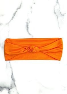 Instantly elevate any hairstyle with this ultra stretchy, super soft top knot headband. It's reversible, too! Instantly transforms into a non-slip workout headband. Product Details Super stretchy, lightweight, luxuriously soft fabric. 5” wide, scrunchable to desired width. Washer and dryer safe. Do not bleach or iron. Stylist tip: you can tighten or loosen the knot to adjust the size of the headband, so it always fits just how you want it to. One size fits most adults. These come in mini sizes f