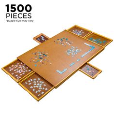 a wooden table topped with lots of puzzles on top of it's sides