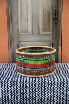 a woven basket sitting on top of a table