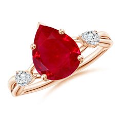 an oval shaped ruby and diamond ring with three diamonds on the band, set in 18k rose gold