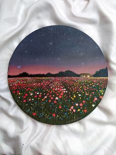 an image of a field with flowers under the night sky