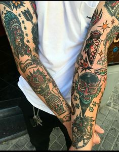 a man with many tattoos on his arms