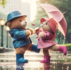 two teddy bears playing in the rain with an umbrella