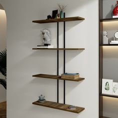 three wooden shelves with books on them against a wall in a living room or dining room