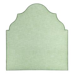 a light green headboard with an arched design