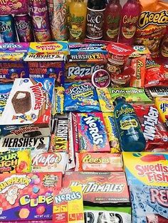 many different types of candy are stacked on top of each other in a pile together