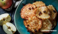 some pancakes and apples on a blue plate