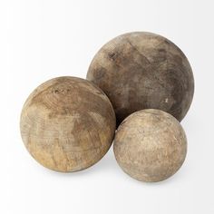 three wooden balls sitting on top of each other