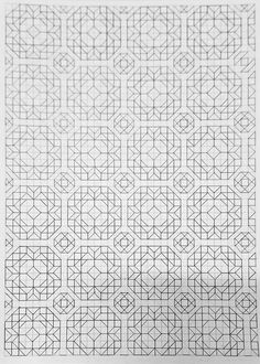 a black and white image of an intricate pattern on paper with lines in the middle