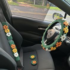 the interior of a car decorated with crochet flowers