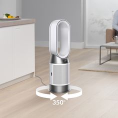 an air purificater is shown in the middle of a living room