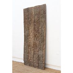 an old carved wooden door with carvings on it's sides and the bottom panel