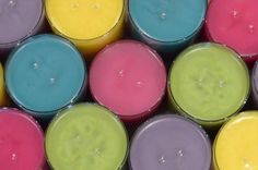 many different colored candles are arranged together