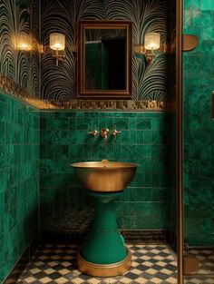 a bathroom with green and gold tiles on the walls, a pedestal sink and mirror