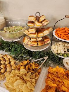 an assortment of snacks are displayed on trays