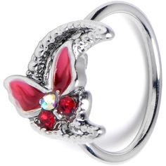 a silver ring with red and white flowers on the front, surrounded by crystal stones