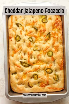 cheddar jalapeno focaccia in a pan with the title above it