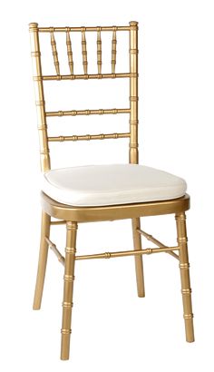 a gold chiavar chair with white cushion on the seat and backrests