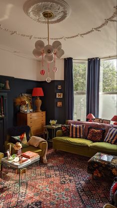 a living room filled with lots of furniture and decor