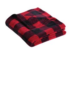 the red and black plaid blanket is folded on top of each other in front of a white background