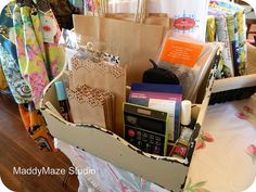 a basket filled with assorted items on top of a bed