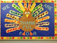 a turkey made out of handprints with the words we are thankful for