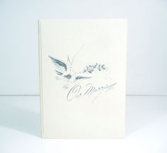 a white card with an image of a bird on it