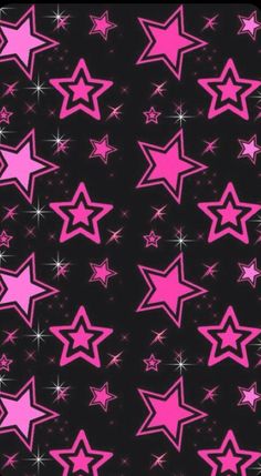 pink stars on black background with sparkles