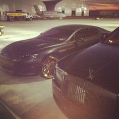 two cars parked next to each other in a parking lot