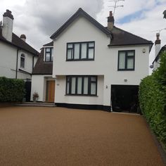 a large white house with black trim and windows