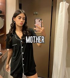 a woman taking a selfie in a bathroom mirror with the caption, mother