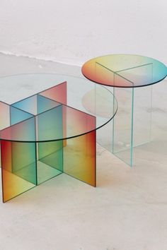 three tables with different colored shapes on them