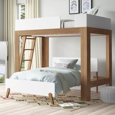 there is a bunk bed with a ladder on the top and a desk underneath it