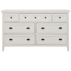 a white dresser with six drawers and two doors on the top drawer, in front of a