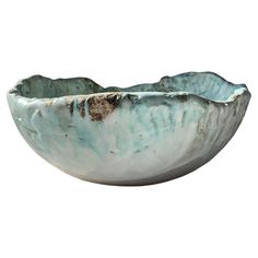 a white and blue bowl sitting on top of a table