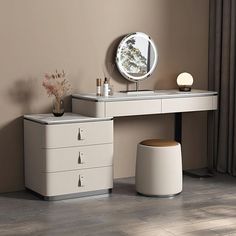 a dressing table with a mirror, stool and vase on the floor next to it