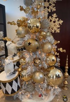 a christmas tree with gold and silver ornaments