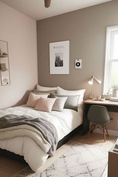 a bedroom with a bed, desk and chair next to a window in the corner