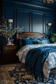 a bedroom with dark blue walls and bedding in the middle, along with a rug on the floor