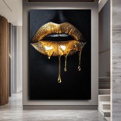 a painting with gold lips dripping from it's mouth on a black and white wall