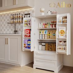 an open refrigerator in a kitchen next to white cupboards and cabinets with gold lettering on the wall