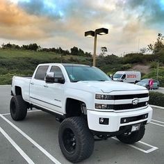 a white truck parked in a parking lot