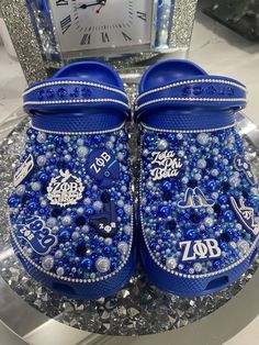 Crocs will be designed similarly to photos. Charm placement and type may vary. You may choose the color of your crocs blue, black, or white. Zeta Phi Beta Bling Crocs, Blue Bling Crocs, Decorated Crocs, Blinged Crocs, Aesthetic Crocs, Bedazzled Crocs, Crocs With Charms, Bedazzled Shoes Diy, Bling Crocs