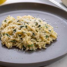 pasta with spinach and parmesan cheese on a plate