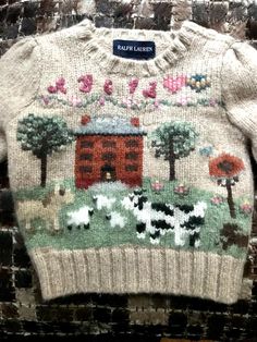 Vintage Ralph Lauren Hand Knit Sweater  Ralph Lauren Iconic Sampler Sweater  Polo Ralph Lauren Baby Sweater  Hand knit and embroidered  Beige  Crew Neck Sweater with Needlepoint design 100 % Wool  Size 18 Months Naive and sweet pastural pattern A B C  AND  1 2 3 Whimsical design of Trees, House, Clouds, Dogs, Villagers on front and each sleeve. Reminds me of the Richard Scarry books I loved as a child. Adorable button closure on left shoulder & pleated puff at the shoulders make these piece very Baby Knit Sweater, Knit Baby Clothes, Trees House, Richard Scarry, Crochet Baby Sweater, Hand Knit Sweater, Sweater Polo, Knit Baby Sweaters, Vintage Toddler