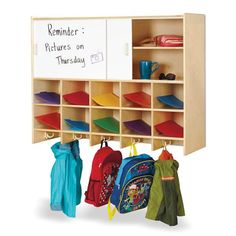 a child's coat rack with backpacks and books